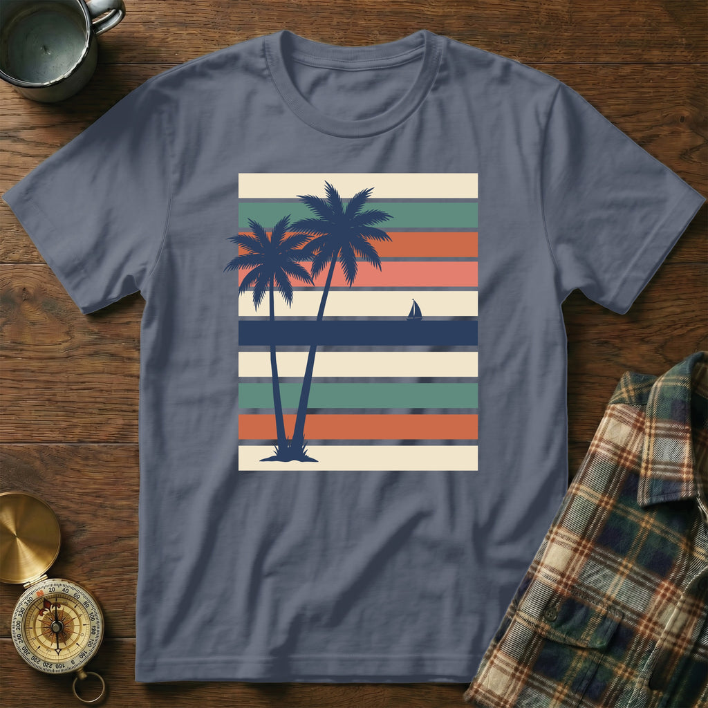 T-shirt with two palm trees and sailboat on striped background.