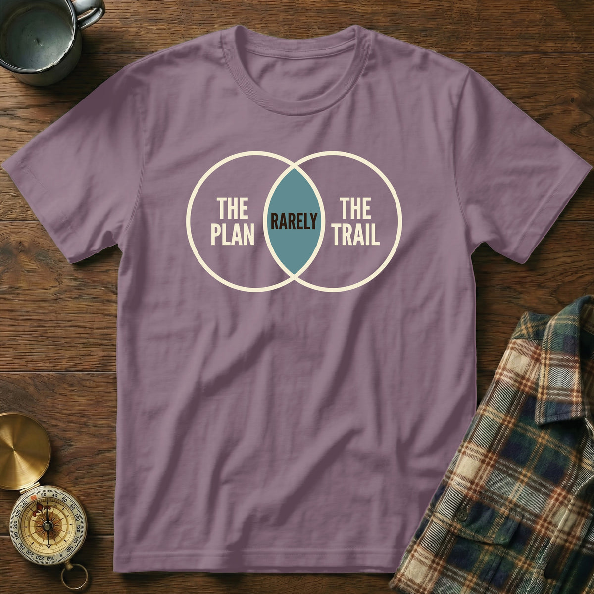 Purple t-shirt with Venn diagram graphic: "The Plan", "Rarely", "The Trail".