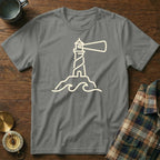 Grey t-shirt with a white line drawing of a lighthouse on a rocky island with waves.