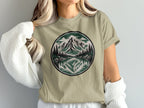 T-shirt with circular mountain and lake reflection graphic print.