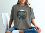 Graphic t-shirt with a circular ocean scene featuring starfish and coral.