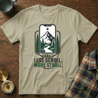 Light tan t-shirt with "Less Scroll. More Stroll." text and phone graphic.