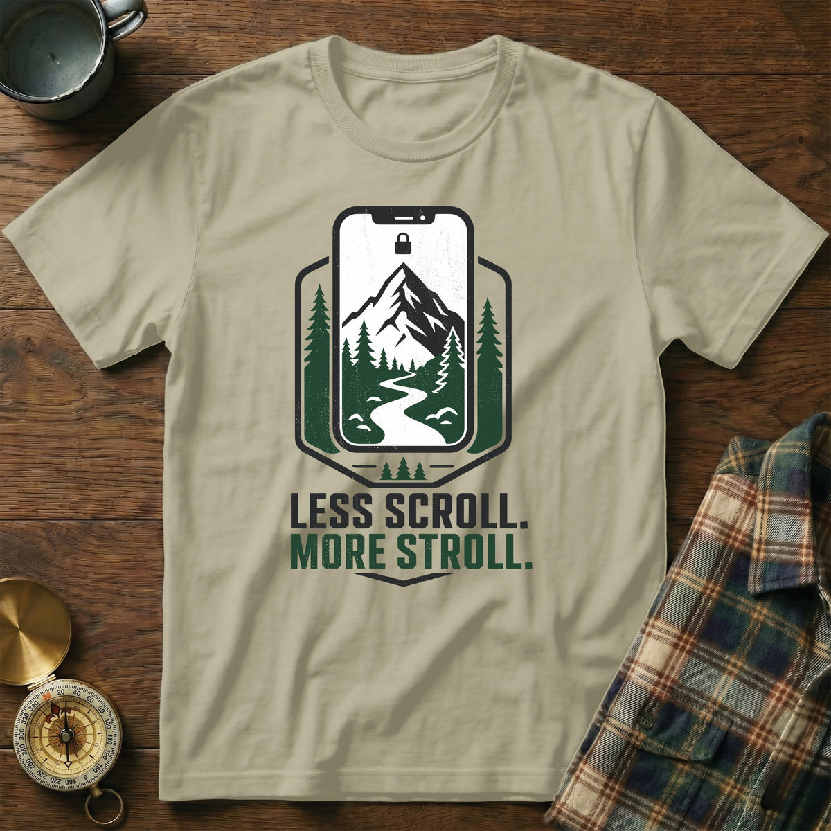Light tan t-shirt with "Less Scroll. More Stroll." text and phone graphic.