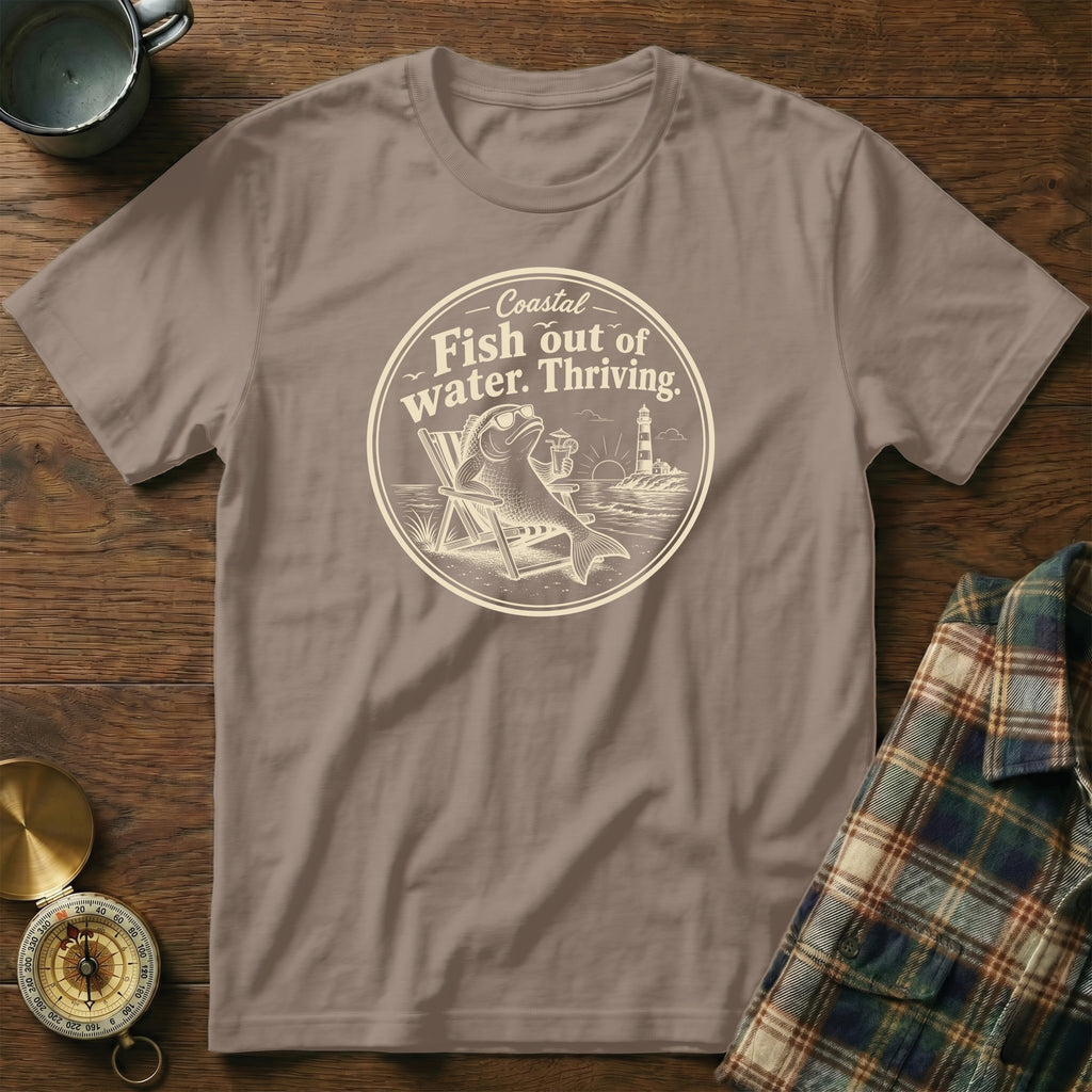 Muted brown crewneck t-shirt featuring a circular graphic of a fish lounging in a beach chair.