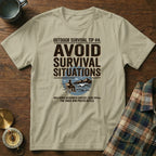 T-shirt with "Outdoor Survival Tip #4: Avoid Survival Situations" text and graphic.