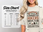 Size chart for heavyweight adult t-shirt with "Exhausted Hikers Social Club" graphic.