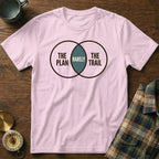 Pink t-shirt with Venn diagram graphic: "THE PLAN", "RARELY", "THE TRAIL".