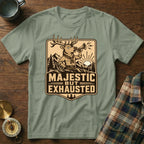 T-shirt displaying a distressed deer blowing a horn, text reads "Majestic But Exhausted".