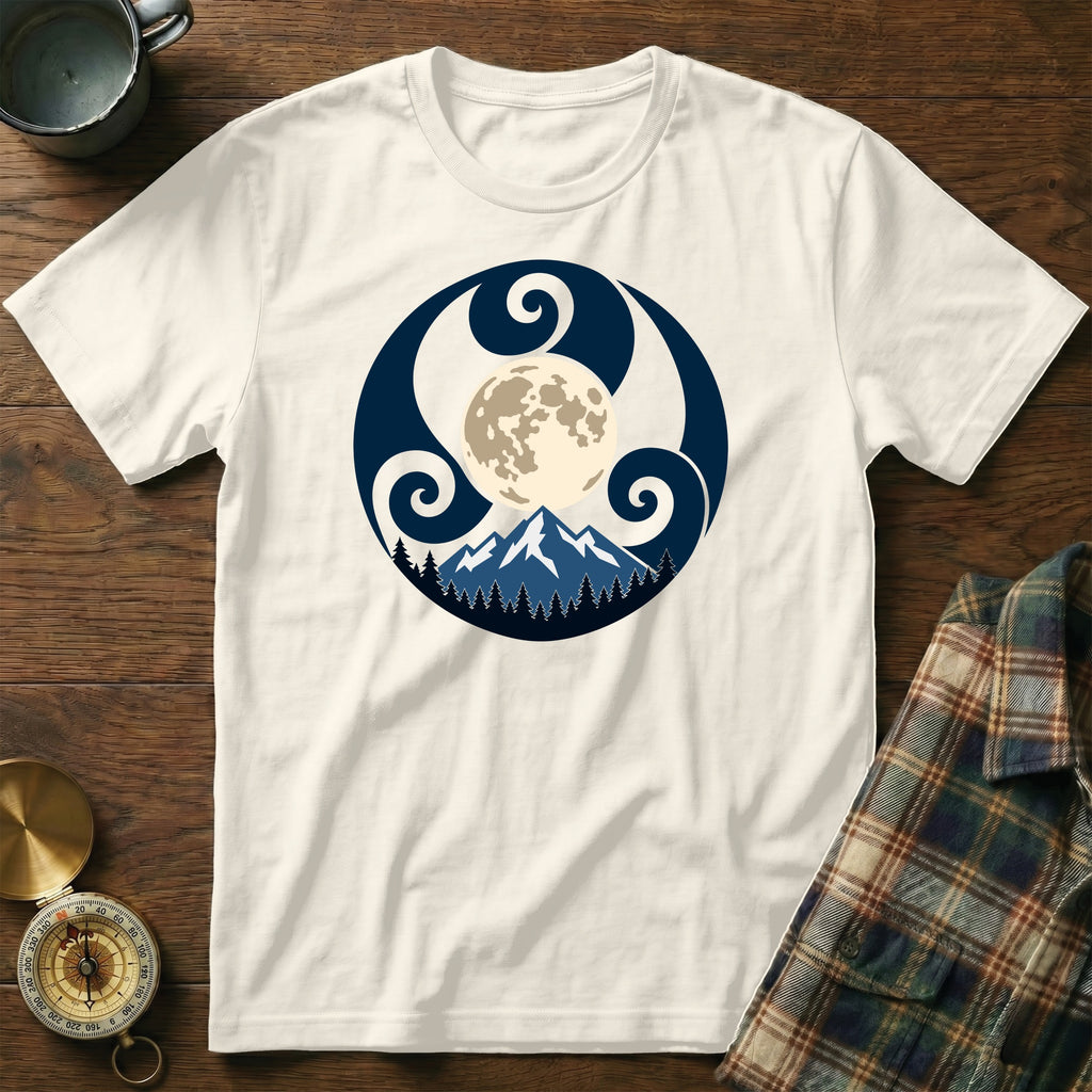 Cream t-shirt with a circular graphic of a mountain, trees, and moon within a Celtic-inspired design.