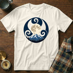 Cream t-shirt with a circular graphic of a mountain, trees, and moon within a Celtic-inspired design.