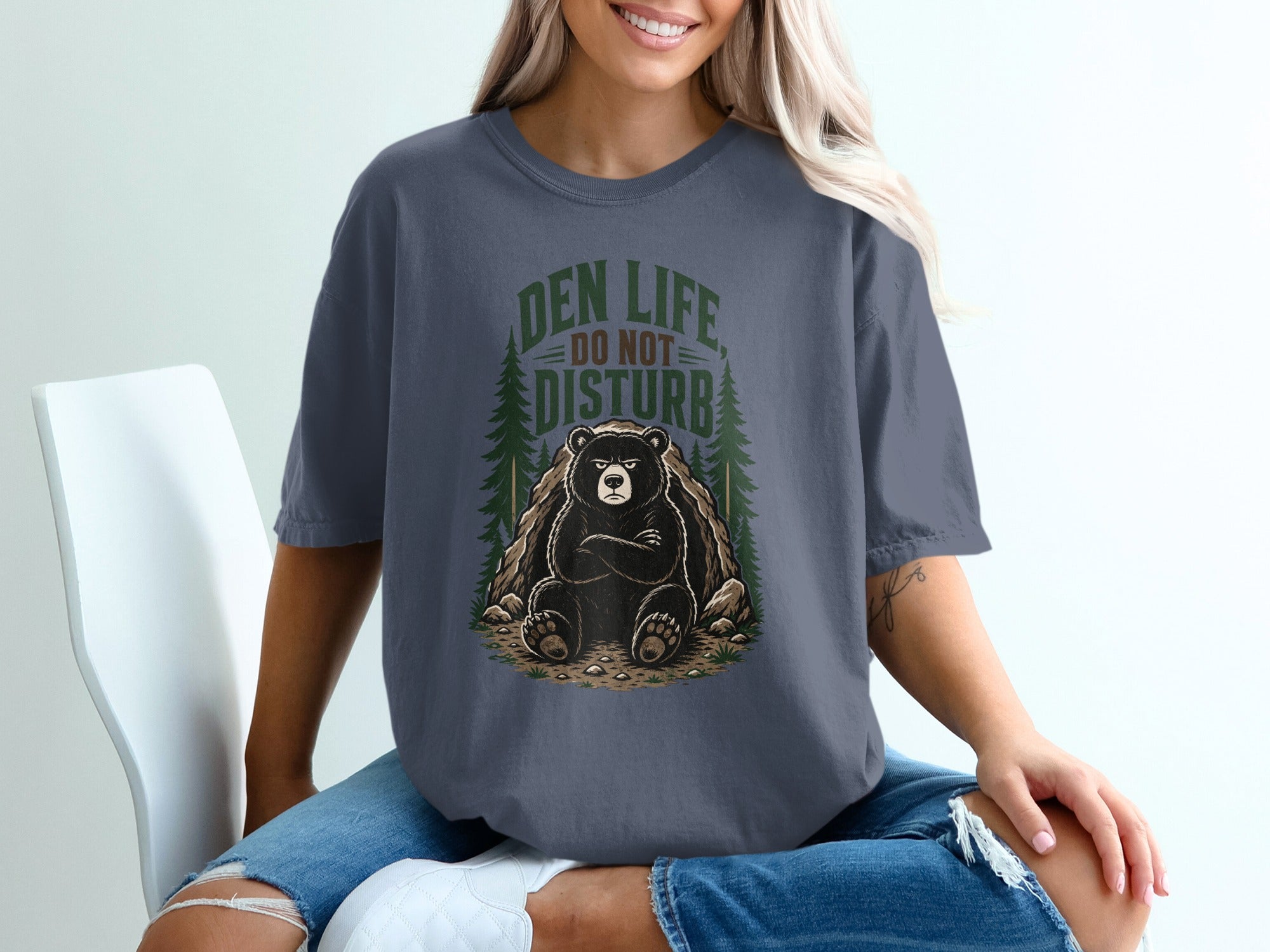 T-shirt graphic of a bear with crossed arms and text "DEN LIFE DO NOT DISTURB".