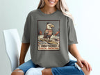 Graphic tee with eagle on surfboard, text "UNBOTHERED COASTAL AMERICANA".