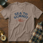 T-shirt with "Sea to Summit" text and a mountain and wave graphic.