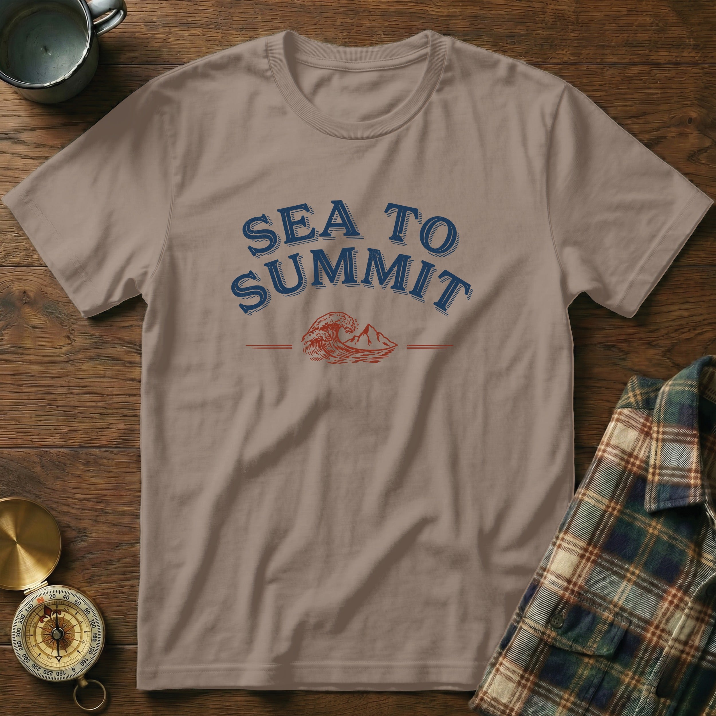 T-shirt with "Sea to Summit" text and a mountain and wave graphic.