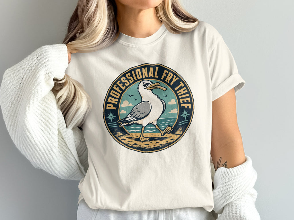 Circular graphic with seagull holding french fry and text "PROFESSIONAL FRY THIEF".