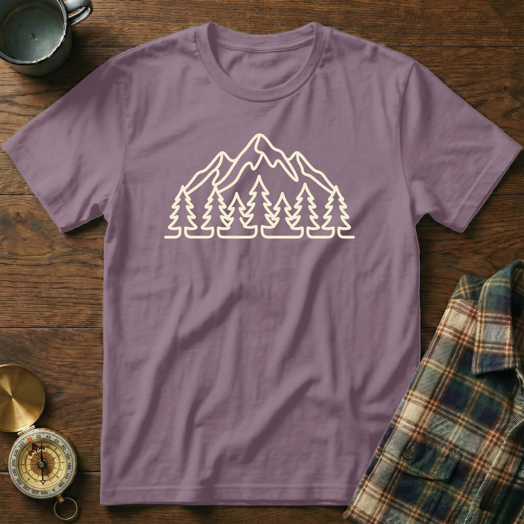 Purple t-shirt with outline graphic of mountains and pine trees.