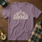 Purple t-shirt with outline graphic of mountains and pine trees.