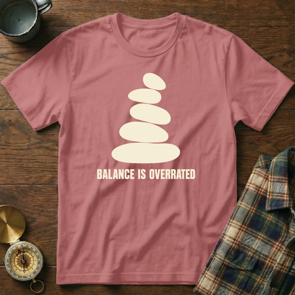 Rose t-shirt with stacked stones graphic and "BALANCE IS OVERRATED" text.