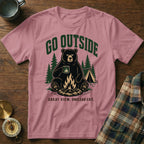 Pink t-shirt with a bear holding a mug by a campfire and tent, text "GO OUTSIDE".