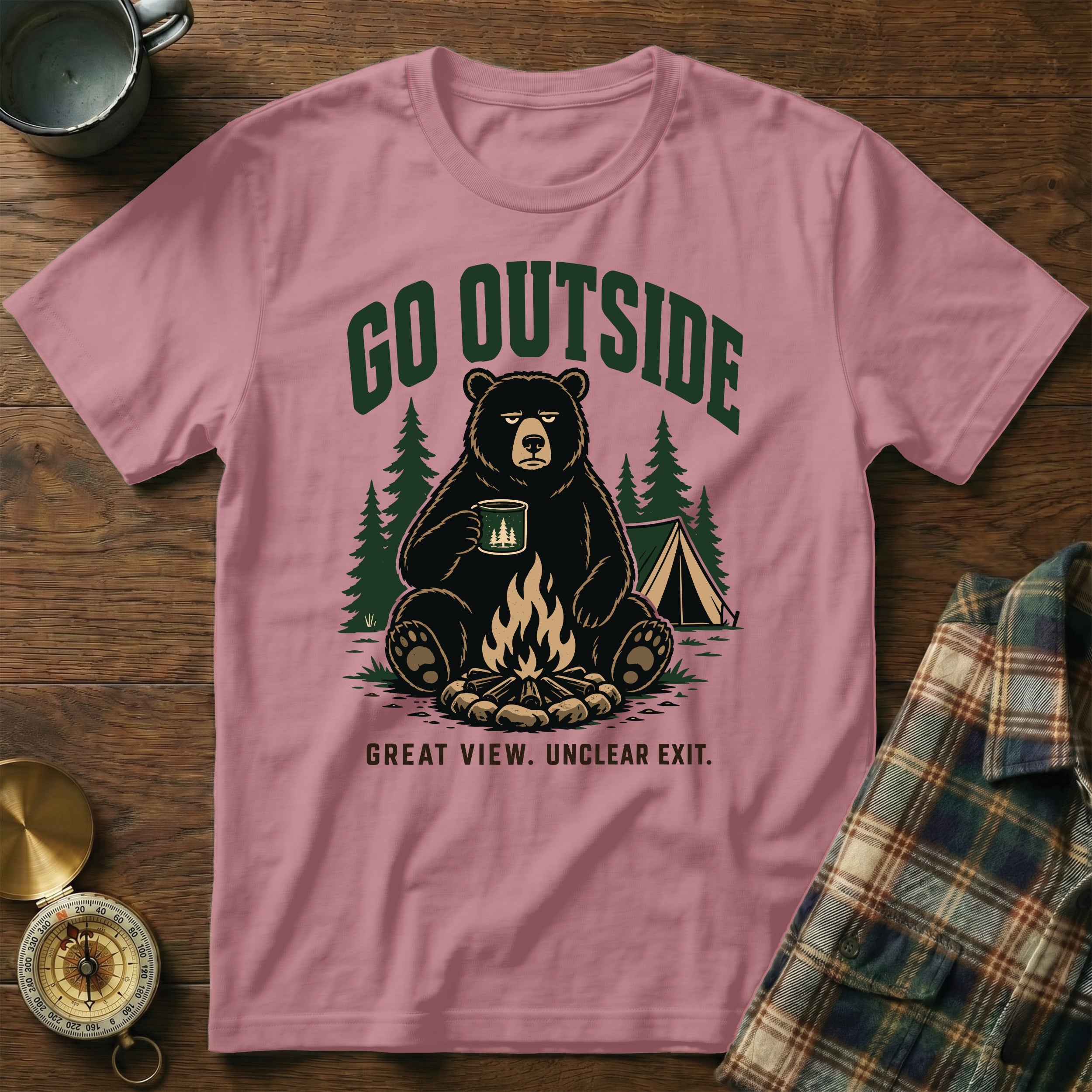 Pink t-shirt with a bear holding a mug by a campfire and tent, text "GO OUTSIDE".