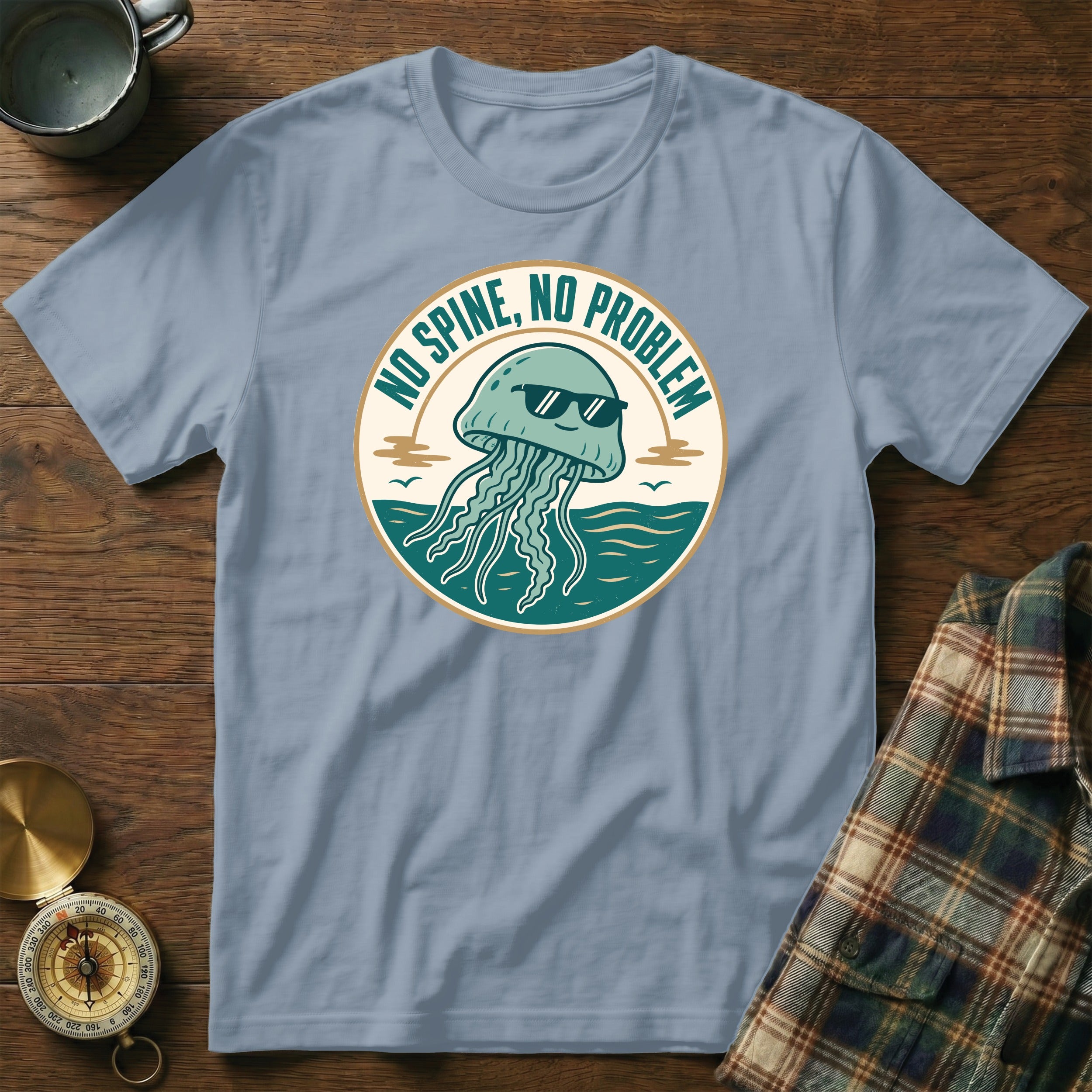 Light blue t-shirt with a cartoon jellyfish wearing sunglasses and text "NO SPINE, NO PROBLEM".