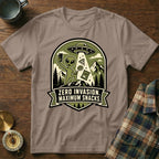 T-shirt with graphic of an alien taking a selfie with pizza, donut, and chips from a UFO.