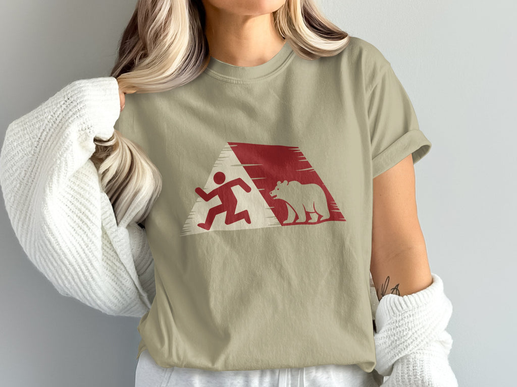 T-shirt with red graphic of a running person and a bear.