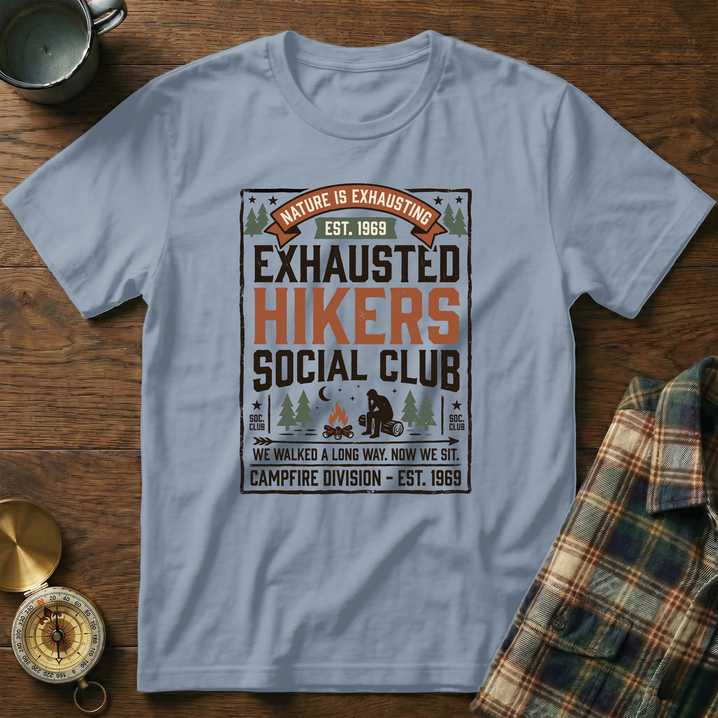 T-shirt design with "Exhausted Hikers Social Club" and nature graphics.