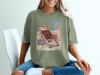 Eagle wearing sunglasses lounging in a beach chair with a palm tree.
