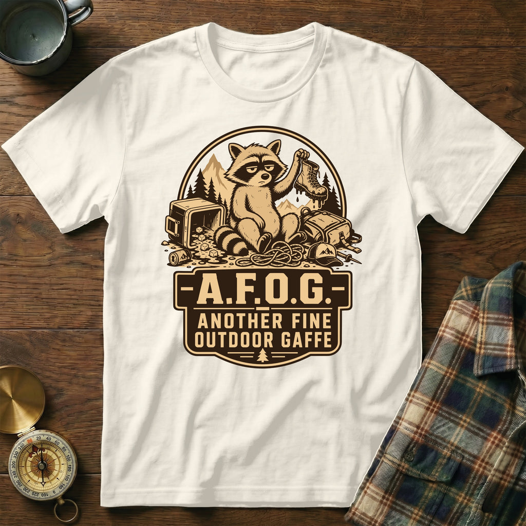 White t-shirt with raccoon graphic and text "A.F.O.G. Another Fine Outdoor Gaffe"