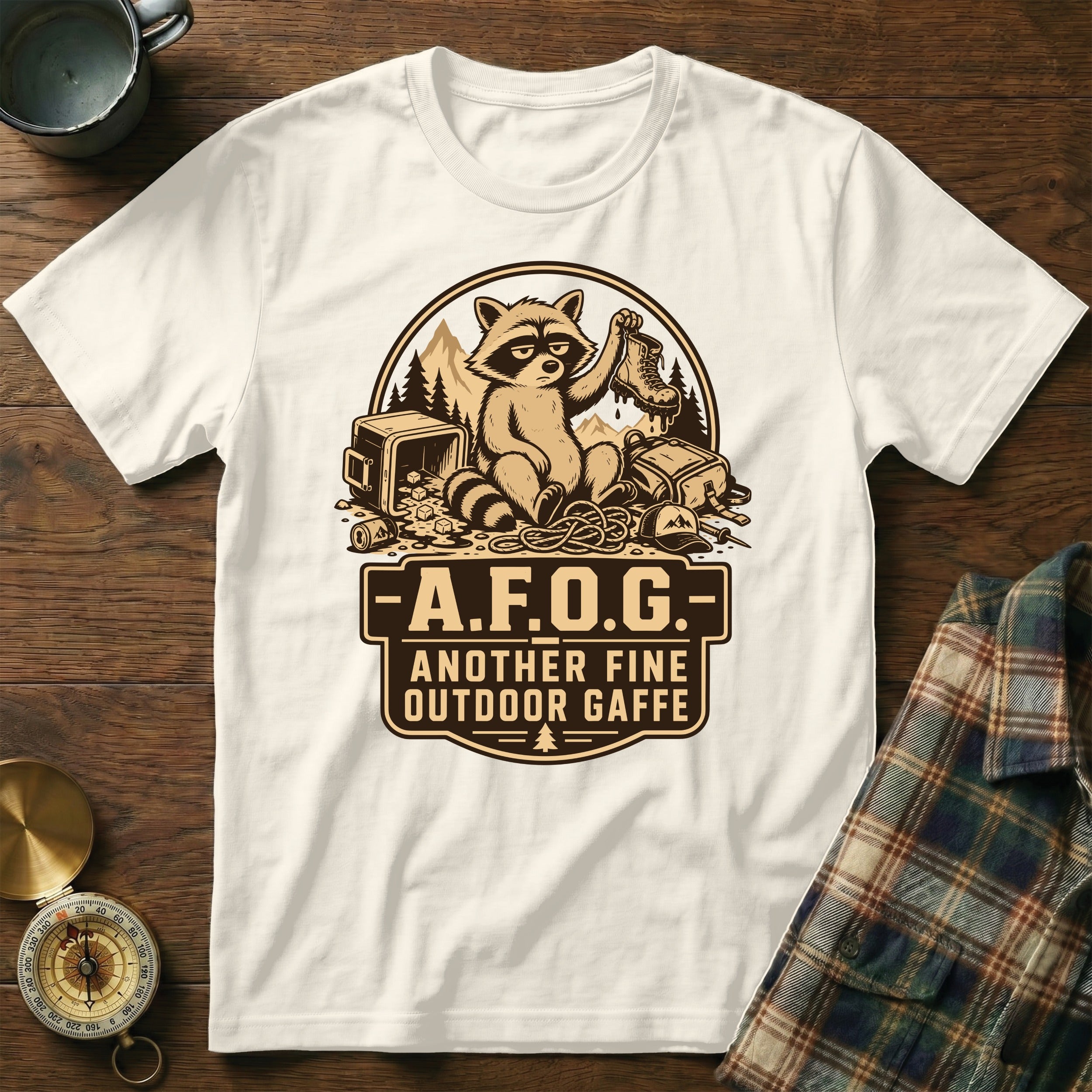 White t-shirt with raccoon graphic and text "A.F.O.G. Another Fine Outdoor Gaffe"