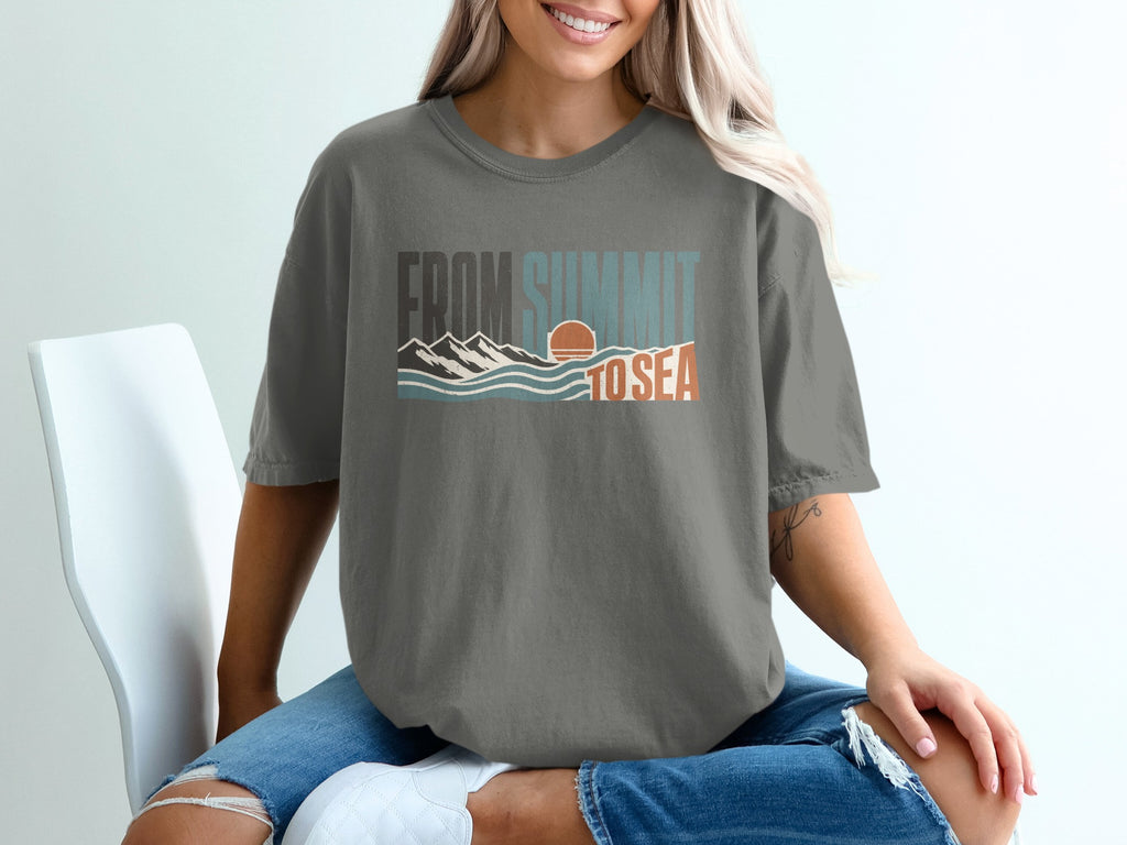T-shirt with "From Summit to Sea" text and mountain and ocean graphic.