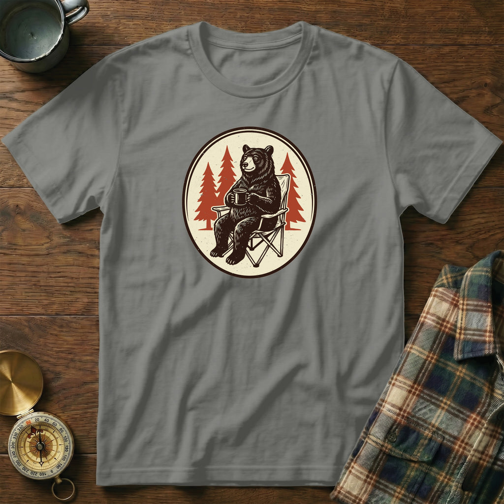 Grey t-shirt with a graphic of a bear in a camping chair holding a mug.
