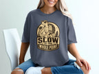 T-shirt with graphic "Slow is the Whole Point" featuring a sunglasses-wearing turtle.