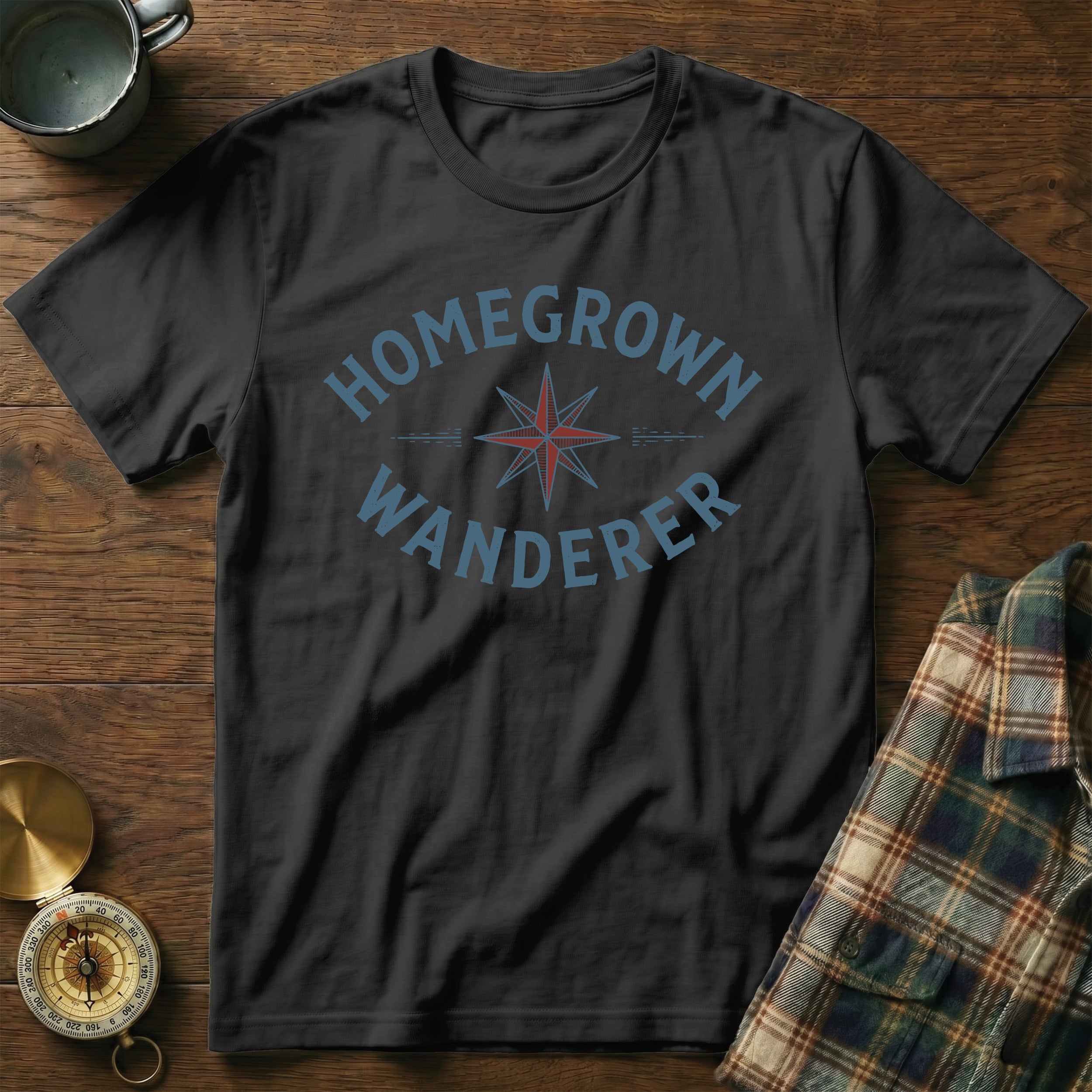 Black t-shirt with "HOMEGROWN WANDERER" text and compass graphic.