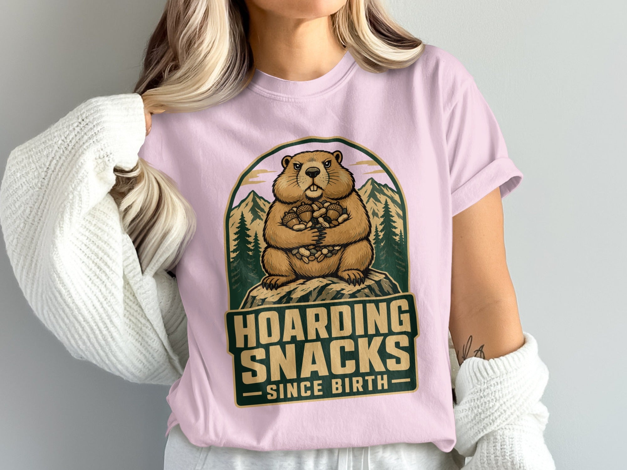Groundhog with acorns on pink t-shirt text "Hoarding Snacks Since Birth".