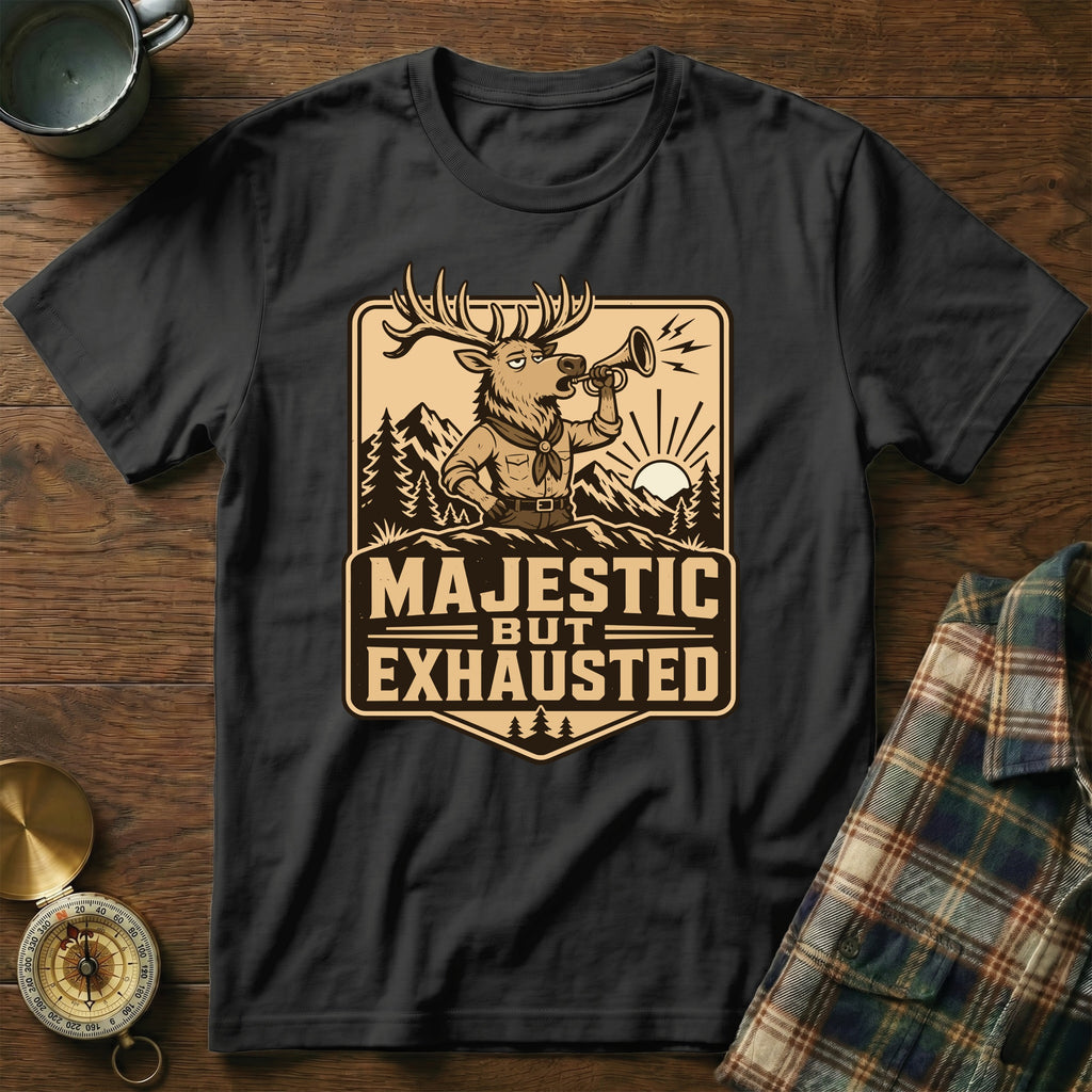 T-shirt with a graphic of a deer blowing a horn, reading "Majestic But Exhausted".