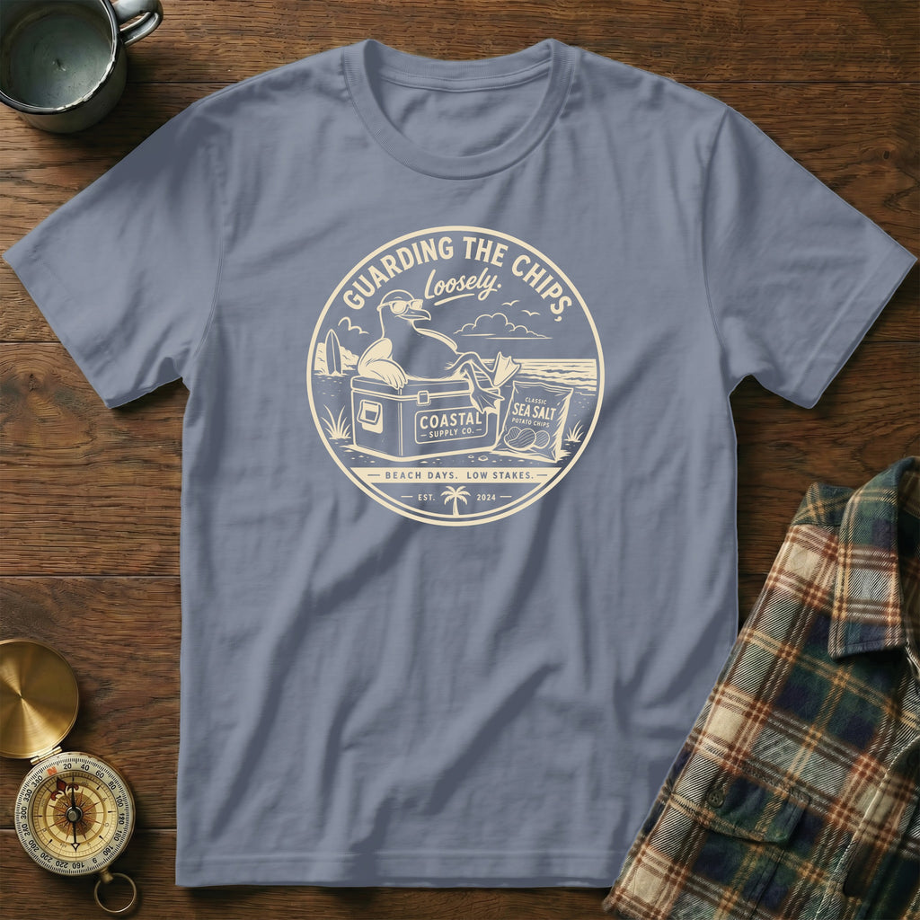 T-shirt with a seagull guarding chips graphic, saying "Guarding the Chips Loosely."