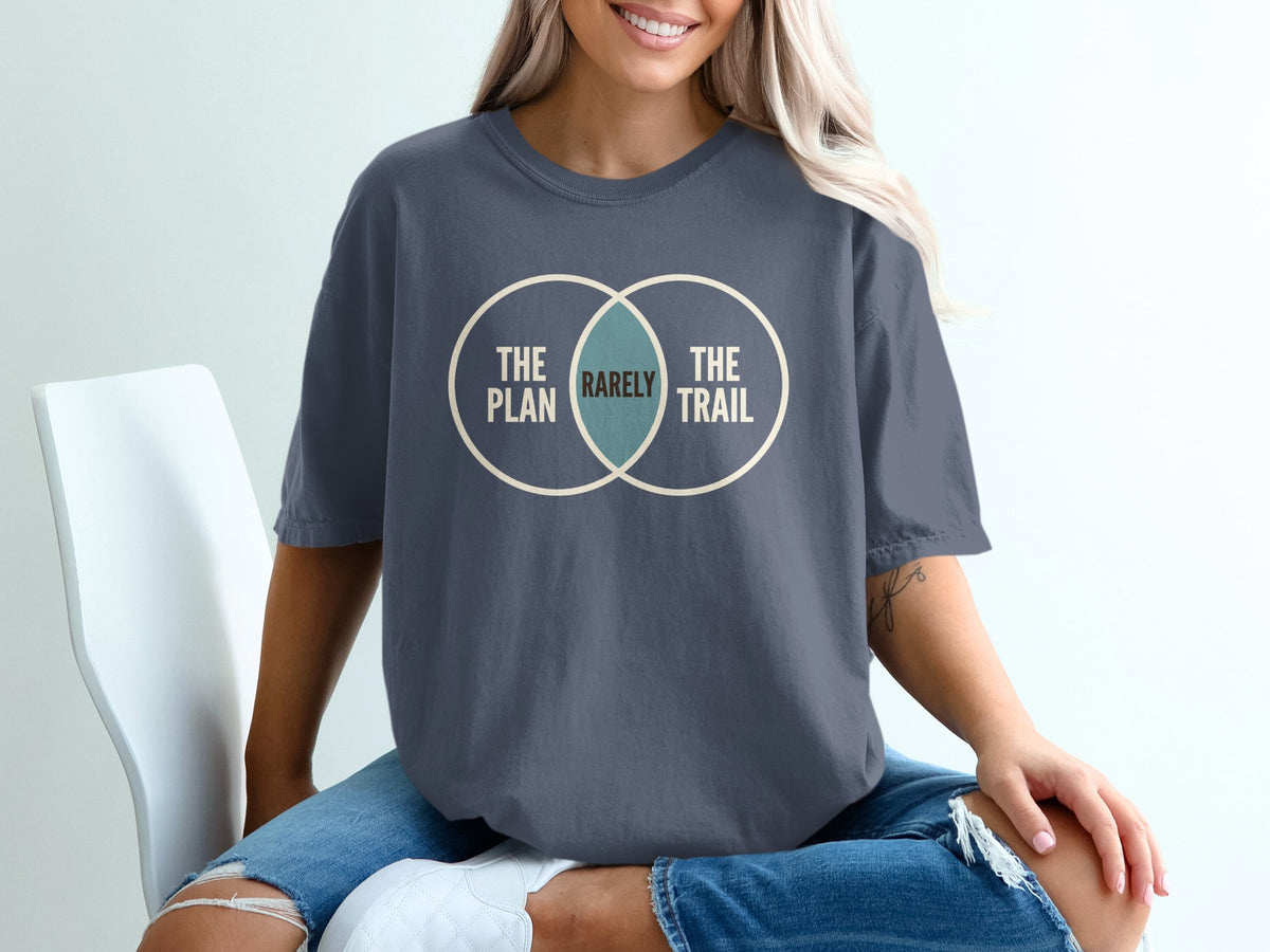 Dark blue t-shirt with Venn diagram graphic reading "The Plan," "Rarely," and "The Trail."
