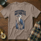 T-shirt with a heron graphic and "Professionally Motionless" text.