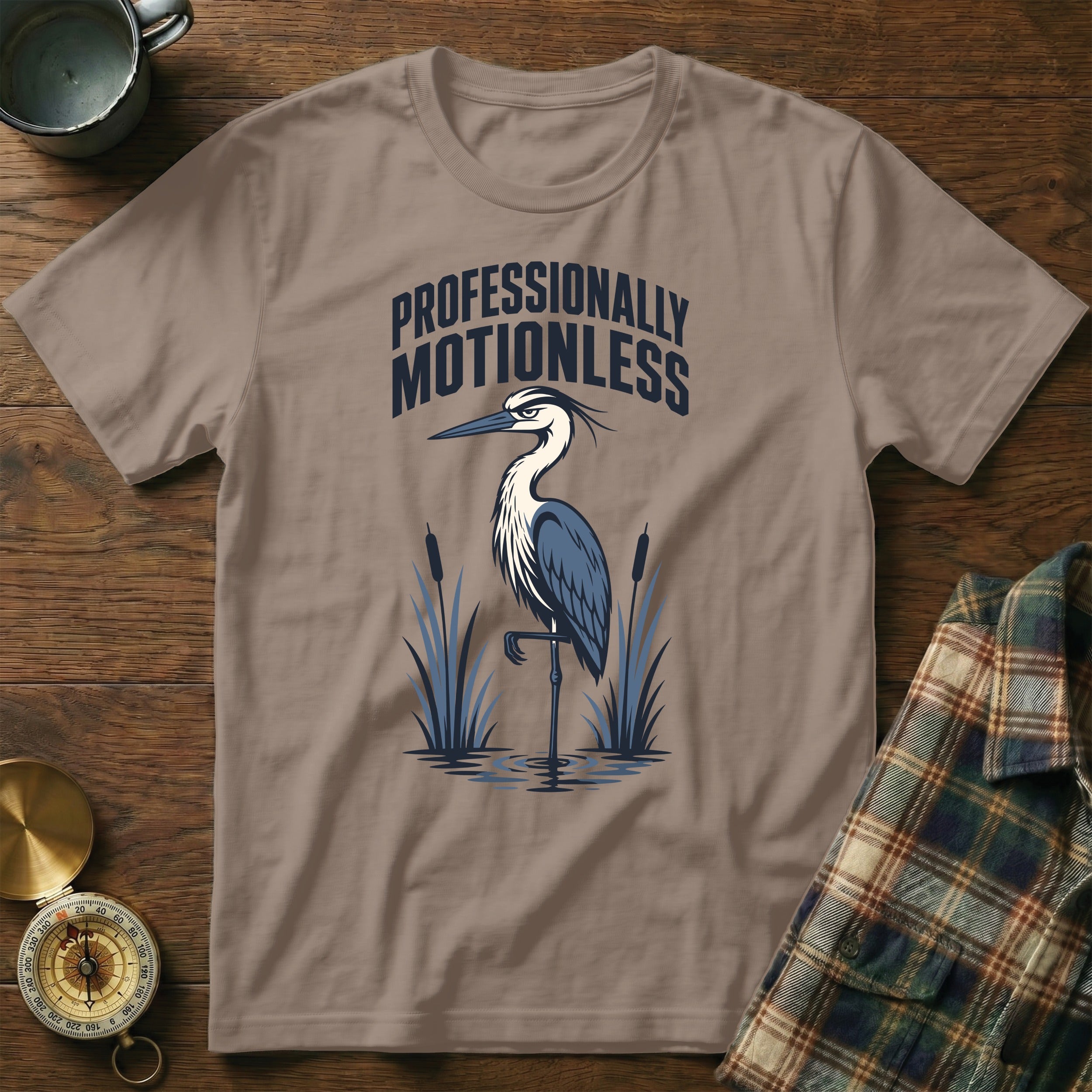 T-shirt with a heron graphic and "Professionally Motionless" text.