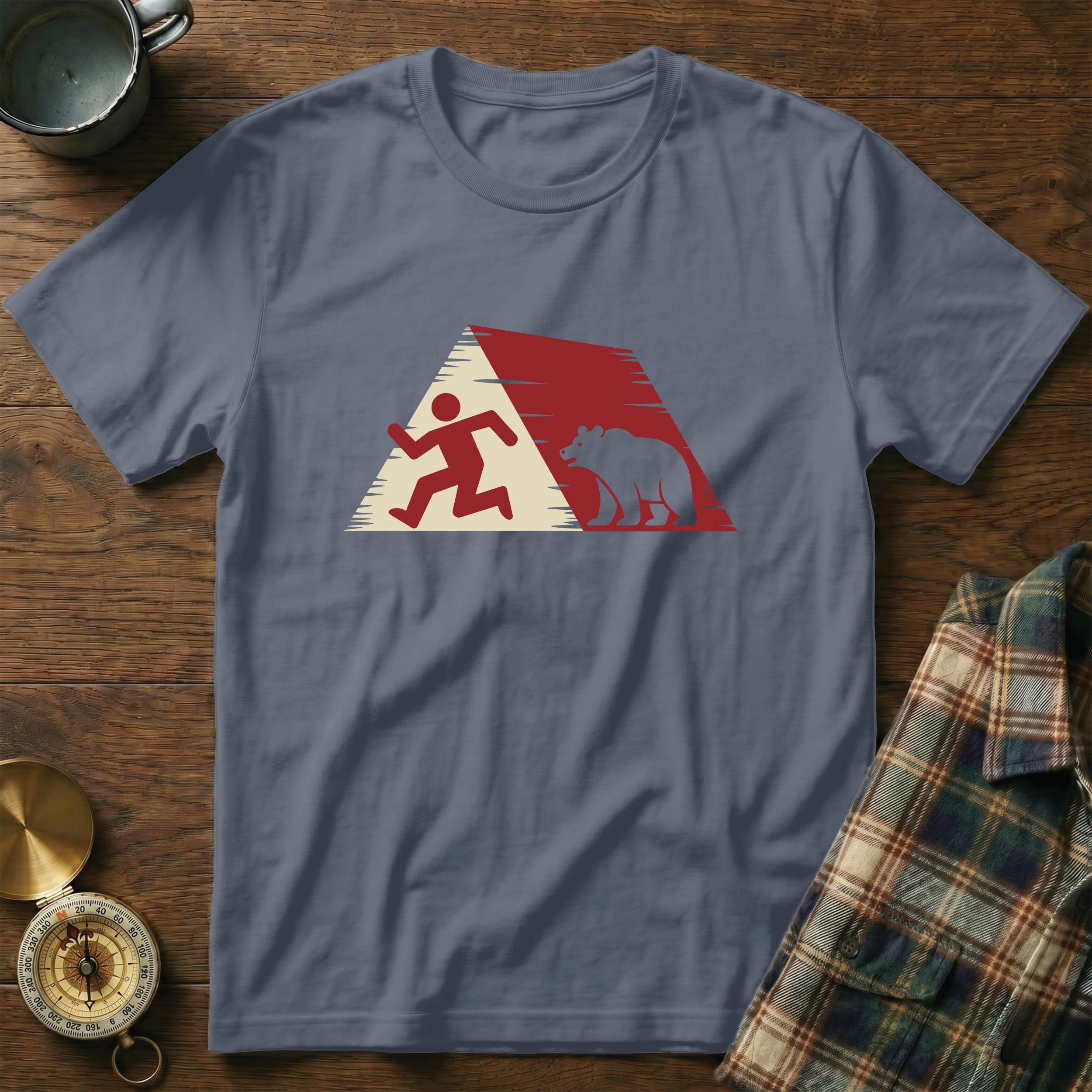 T-shirt with running figure and bear silhouette inside red mountain outline.