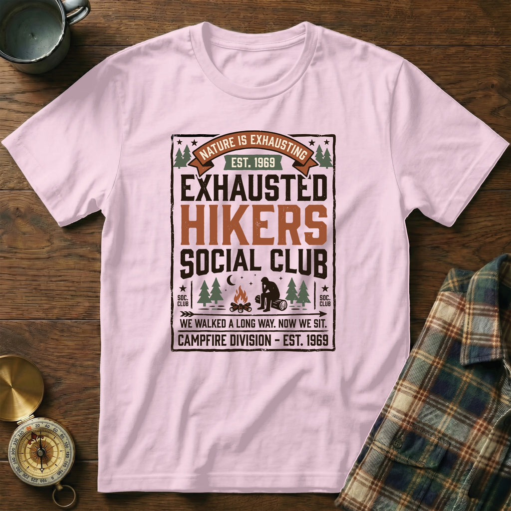 Pink t-shirt with "Exhausted Hikers Social Club" graphic and campfire scene.