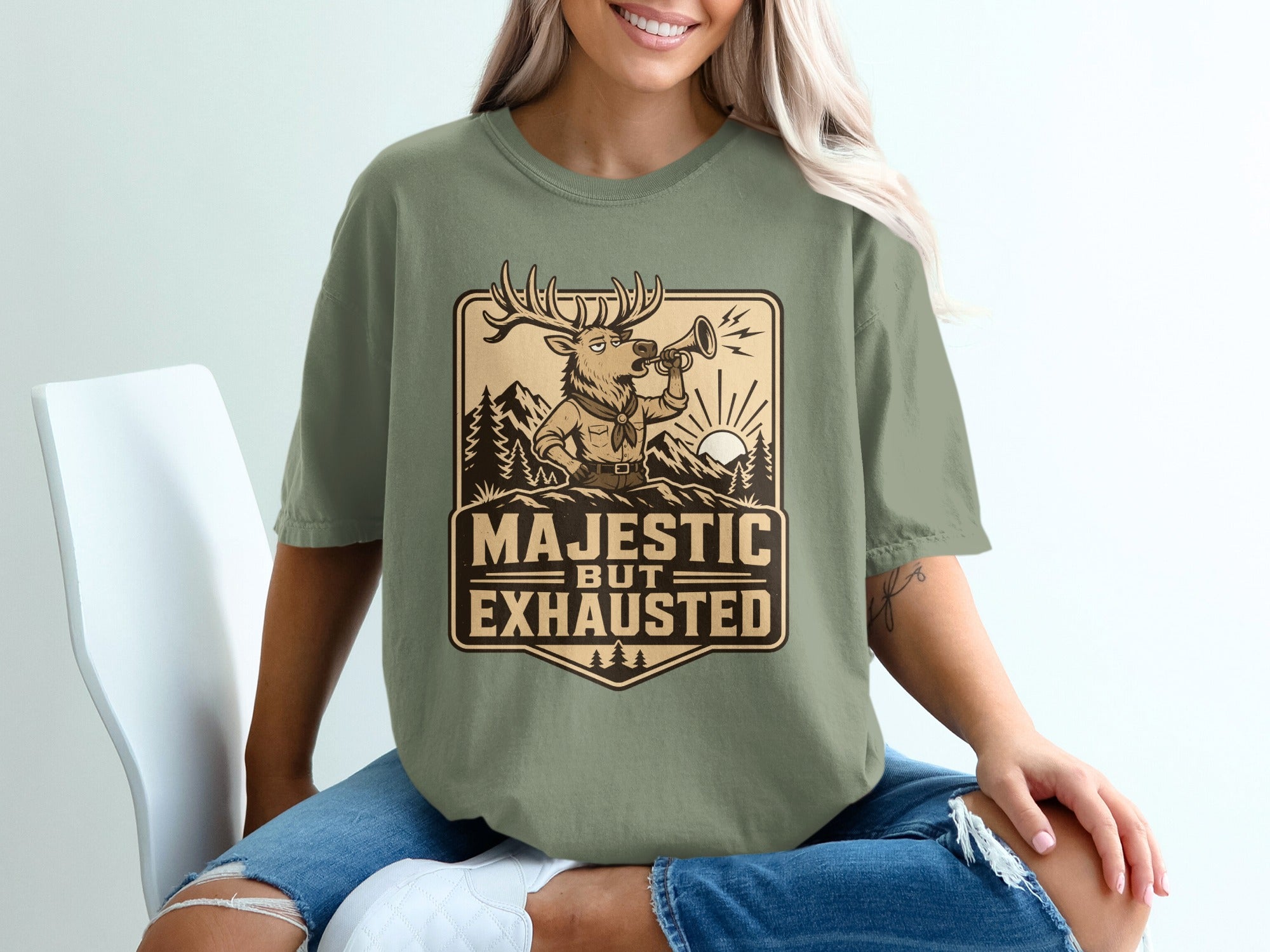 Deer with antlers blowing a horn with text "Majestic but Exhausted"