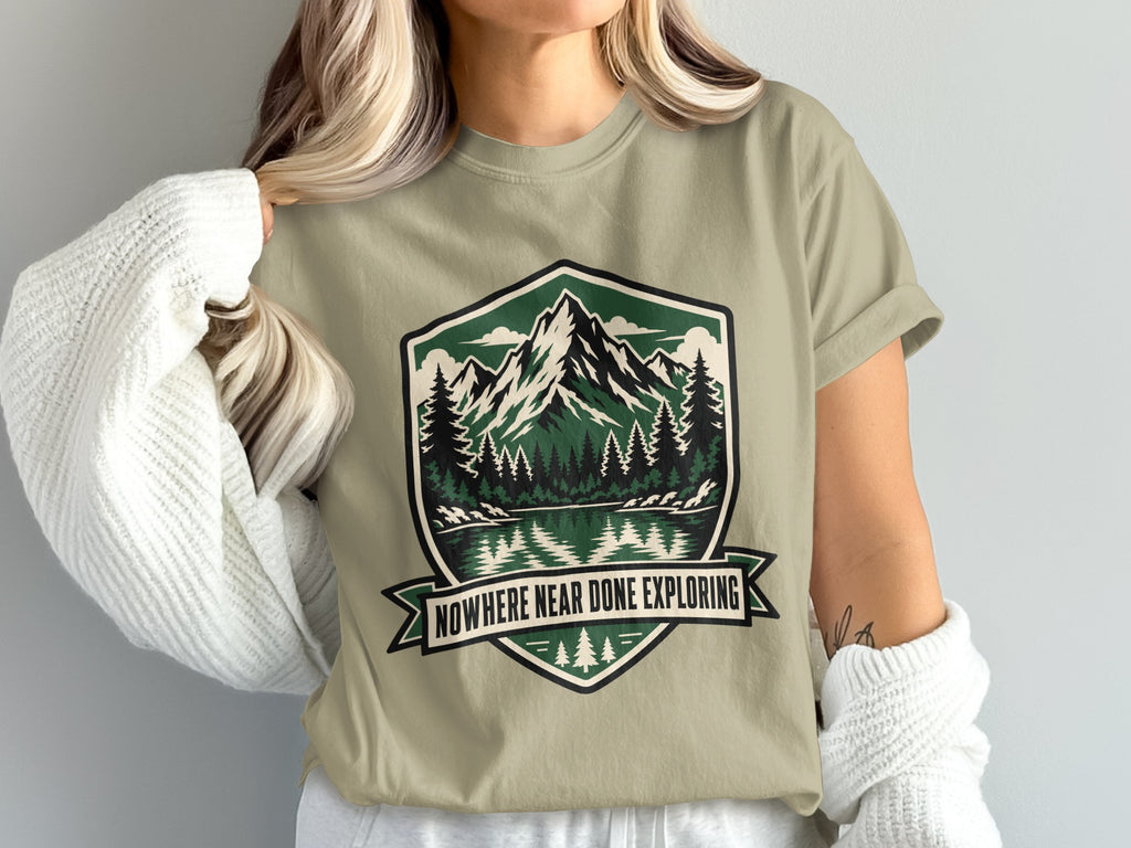 T-shirt with nature graphic and text "Nowhere Near Done Exploring".