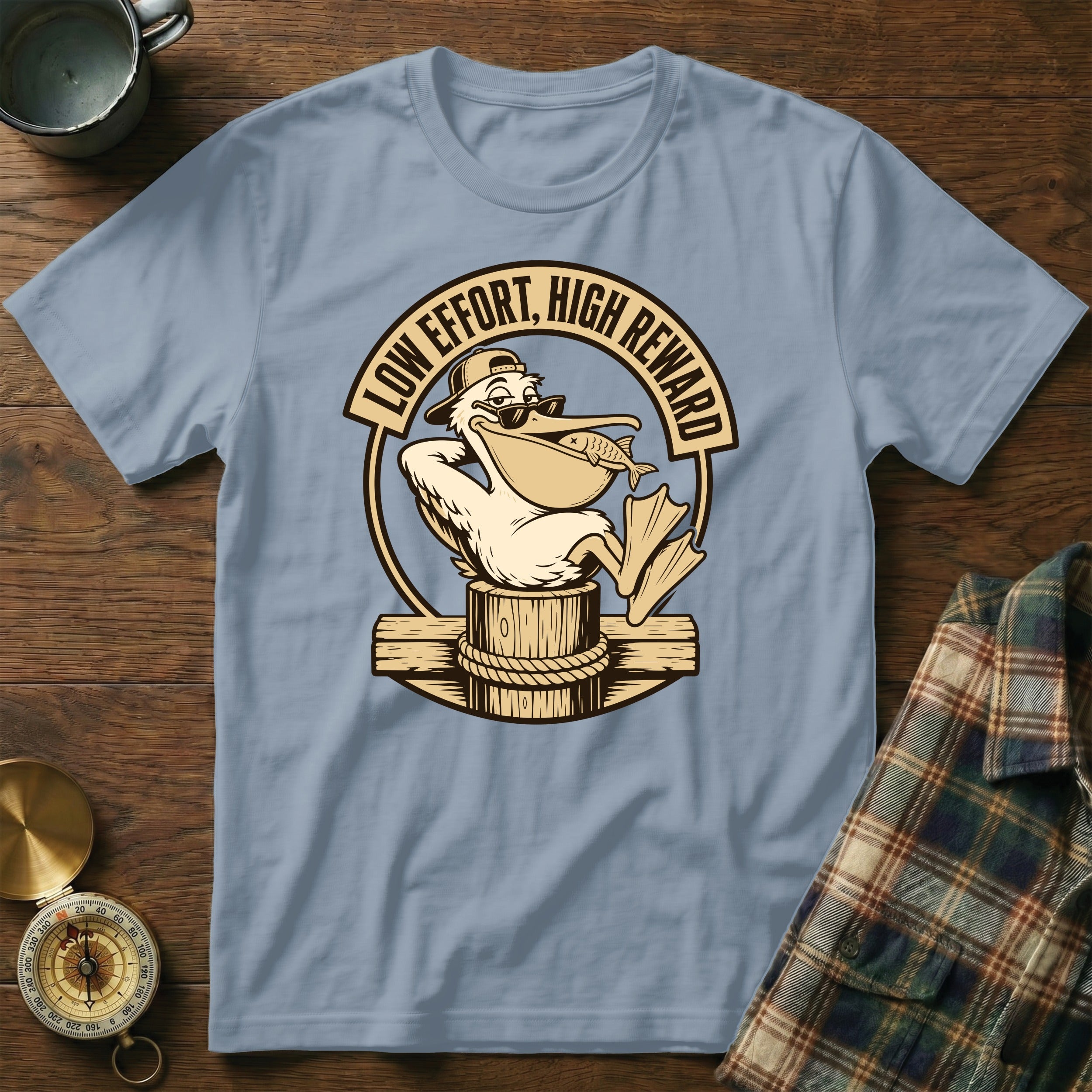 Pelican wearing sunglasses and cap holding fish with text "LOW EFFORT, HIGH REWARD".