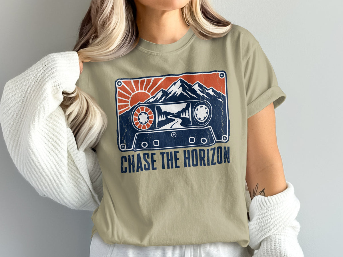T-shirt with cassette tape graphic, mountains, sun, and text "CHASE THE HORIZON".