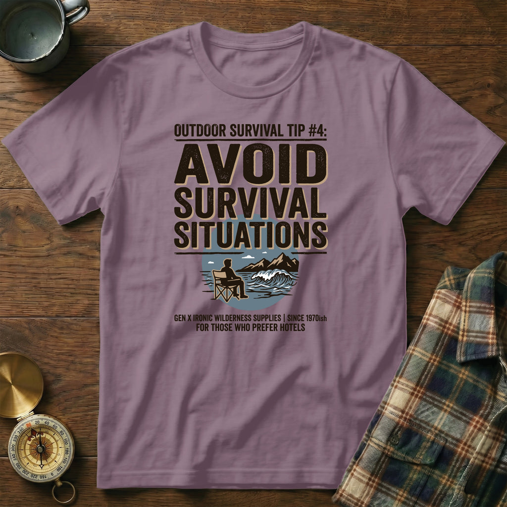 Purple t-shirt with "Avoid Survival Situations" text, outdoorsy graphic, and branded slogan.