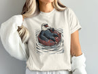 Bald eagle wearing sunglasses and drinking from a cup while floating on an inner tube.