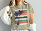 T-shirt with vintage sunset stripes and two palm trees.